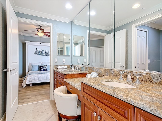 4071 S Atlantic Ave Unit 803, New Smyrna Beach, FL 32169 - ensuite bathroom with crown molding, vanity, ceiling fan, tile patterned floors, and recessed lighting