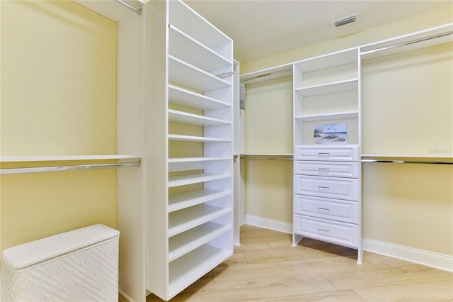 4071 S Atlantic Ave Unit 803, New Smyrna Beach, FL 32169 - walk in closet with light wood-style flooring