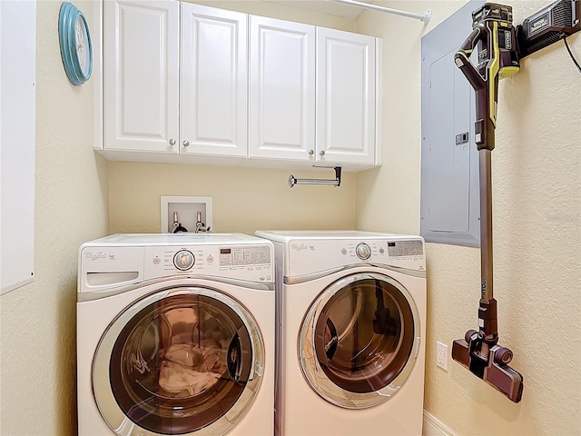 4071 S Atlantic Ave Unit 803, New Smyrna Beach, FL 32169 - laundry room featuring washer and clothes dryer, cabinet space, and electric panel