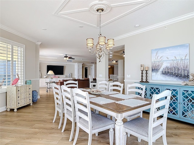 4071 S Atlantic Ave Unit 803, New Smyrna Beach, FL 32169 - dining area featuring ceiling fan, ornamental molding, light wood-style floors, and a chandelier