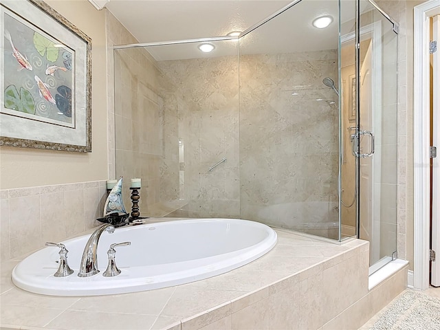 4071 S Atlantic Ave Unit 803, New Smyrna Beach, FL 32169 - bathroom with a stall shower, a bath, and recessed lighting