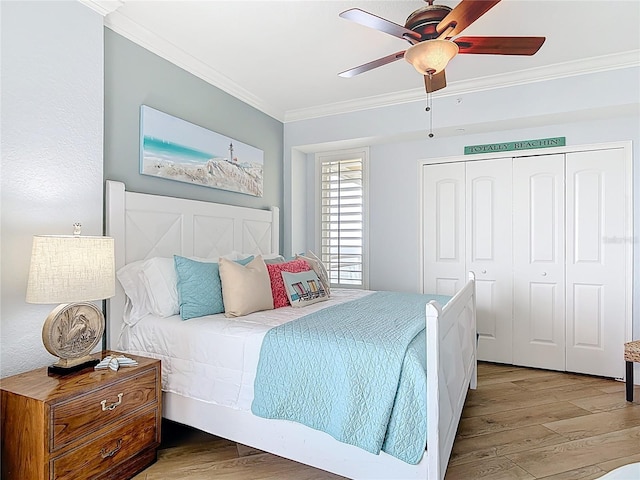 4071 S Atlantic Ave Unit 803, New Smyrna Beach, FL 32169 - bedroom with ornamental molding, wood finished floors, a closet, and a ceiling fan
