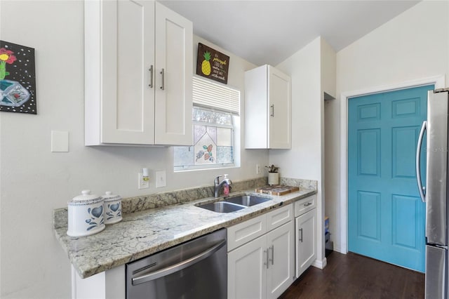 kitchen featuring a sink, white cabinetry, appliances with stainless steel finishes, and dark wood-style flooring