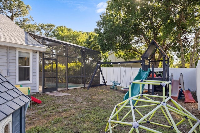 exterior space featuring a fenced backyard and glass enclosure