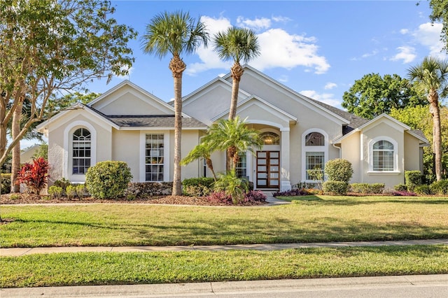11401 Willow Stowe Ln, Windermere, FL 34786 - view of front of house featuring stucco siding and a front yard