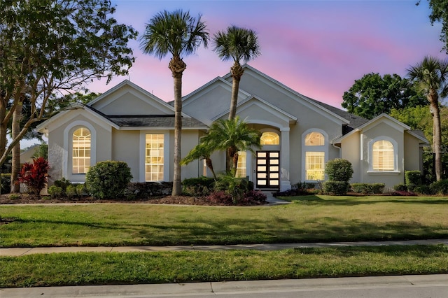 11401 Willow Stowe Ln, Windermere, FL 34786 - view of front of house featuring stucco siding and a front yard