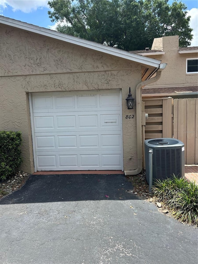 802 Park Lake Cir Unit 2, Maitland, FL 32751 - garage featuring driveway and central AC