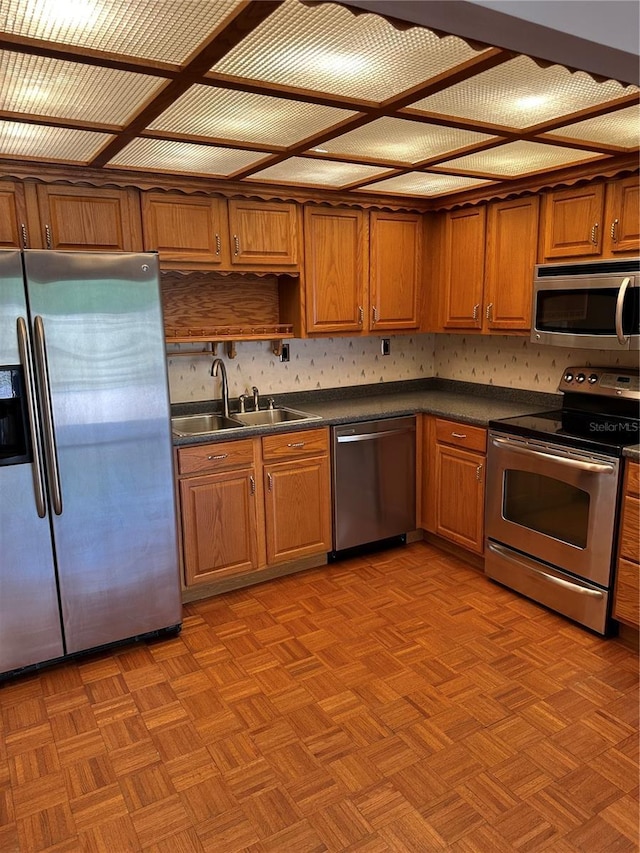 802 Park Lake Cir Unit 2, Maitland, FL 32751 - kitchen with stainless steel appliances, a sink, brown cabinets, and dark countertops