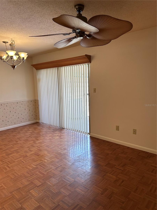 802 Park Lake Cir Unit 2, Maitland, FL 32751 - spare room with ceiling fan with notable chandelier, baseboards, and a textured ceiling