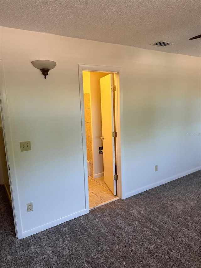 802 Park Lake Cir Unit 2, Maitland, FL 32751 - unfurnished bedroom featuring a textured ceiling, carpet floors, visible vents, and baseboards