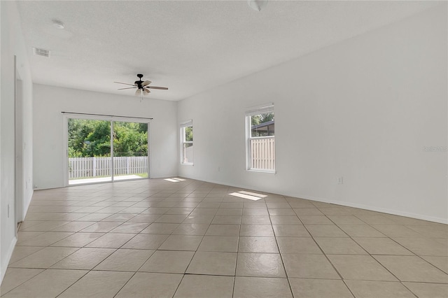 1822 Meadow Pond Way, Orlando, FL 32824 - unfurnished room featuring visible vents, a wealth of natural light, light tile patterned flooring, and ceiling fan