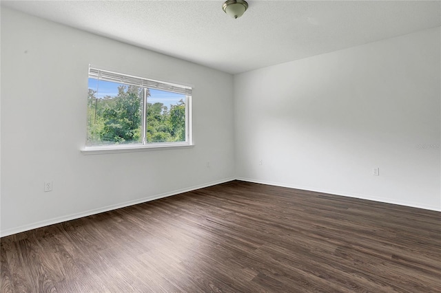 1822 Meadow Pond Way, Orlando, FL 32824 - unfurnished room with a textured ceiling, wood finished floors, and baseboards