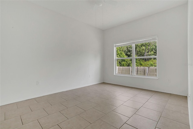 1822 Meadow Pond Way, Orlando, FL 32824 - empty room with light tile patterned floors, ceiling fan, and baseboards