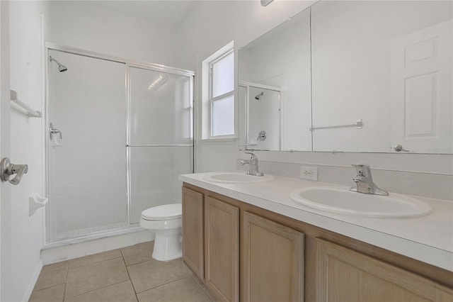 1822 Meadow Pond Way, Orlando, FL 32824 - bathroom with tile patterned floors, a shower stall, and a sink