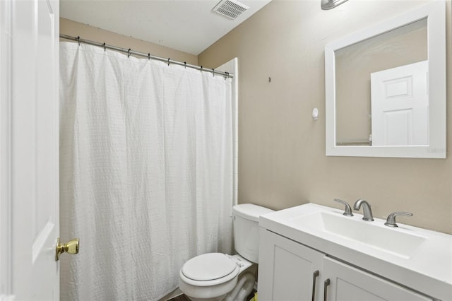 full bath featuring visible vents, vanity, and toilet