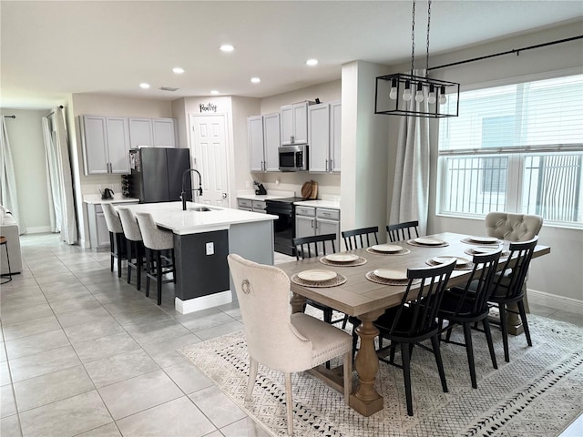 4905 Olivia Ct, Saint Cloud, FL 34772 - dining area featuring light tile patterned floors, baseboards, and recessed lighting