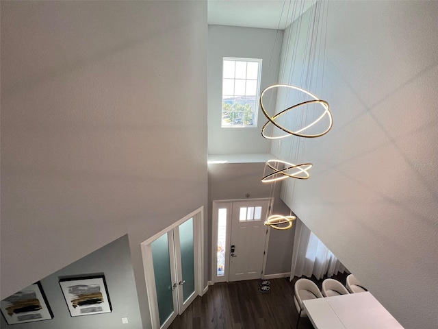 2926 Crest Wave Dr, Clermont, FL 34711 - foyer with dark wood-type flooring, plenty of natural light, and baseboards