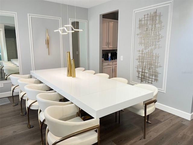 2926 Crest Wave Dr, Clermont, FL 34711 - dining space featuring dark wood-type flooring, a chandelier, and baseboards