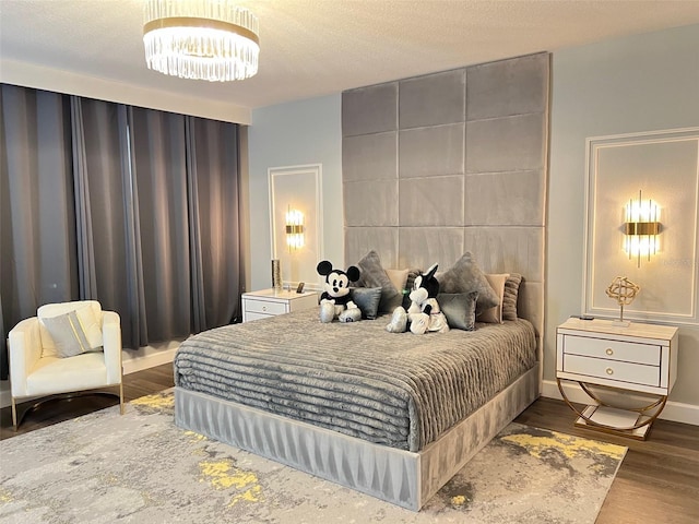 2926 Crest Wave Dr, Clermont, FL 34711 - bedroom with a chandelier and wood finished floors
