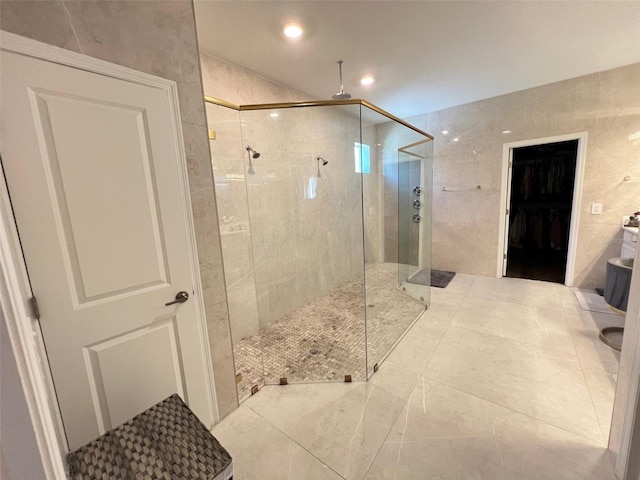 2926 Crest Wave Dr, Clermont, FL 34711 - bathroom with a shower stall, tile walls, and recessed lighting