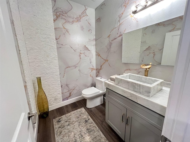 2926 Crest Wave Dr, Clermont, FL 34711 - bathroom with wood finished floors, toilet, and vanity