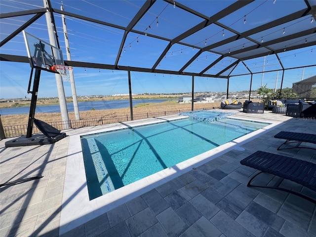 2926 Crest Wave Dr, Clermont, FL 34711 - view of swimming pool featuring a patio area, a lanai, a water view, and a pool with connected hot tub