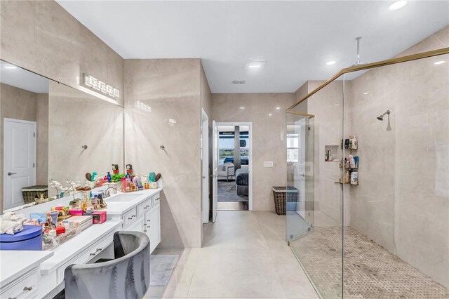 2926 Crest Wave Dr, Clermont, FL 34711 - ensuite bathroom featuring vanity, a shower stall, and tile patterned floors