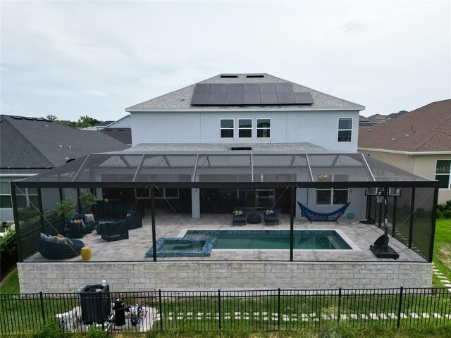 2926 Crest Wave Dr, Clermont, FL 34711 - back of property with a patio, solar panels, and an outdoor living space