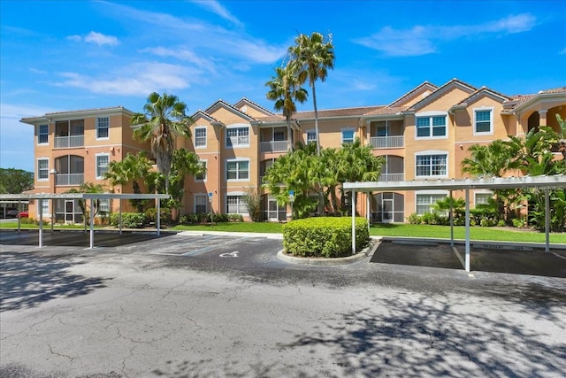 13500 Turtle Marsh Loop Unit 834, Orlando, FL 32837 - view of property with covered and uncovered parking