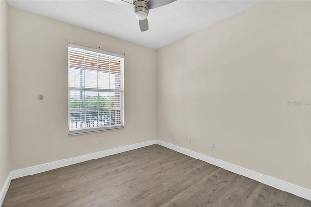 13500 Turtle Marsh Loop Unit 834, Orlando, FL 32837 - unfurnished room featuring ceiling fan, baseboards, and wood finished floors