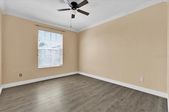 13500 Turtle Marsh Loop Unit 834, Orlando, FL 32837 - empty room featuring baseboards, crown molding, dark wood-style floors, and ceiling fan
