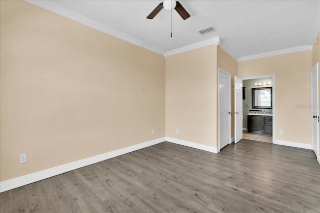 13500 Turtle Marsh Loop Unit 834, Orlando, FL 32837 - spare room with wood finished floors, visible vents, a ceiling fan, ornamental molding, and baseboards