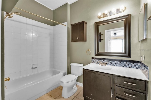 13500 Turtle Marsh Loop Unit 834, Orlando, FL 32837 - bathroom featuring tile patterned floors, backsplash, toilet, vanity, and shower / tub combination