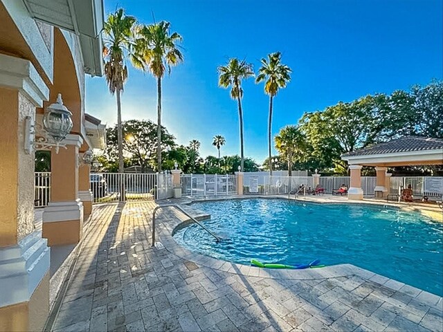 13500 Turtle Marsh Loop Unit 834, Orlando, FL 32837 - community pool with a gazebo, a patio, and fence