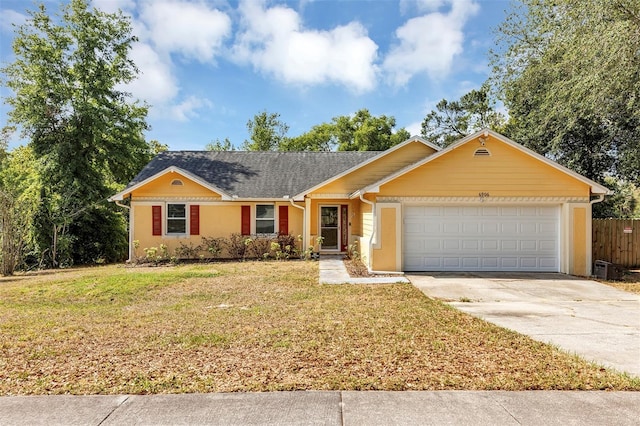 6906 Colony Oaks Ln, Orlando, FL 32818 - ranch-style house featuring a garage, driveway, a front lawn, and fence