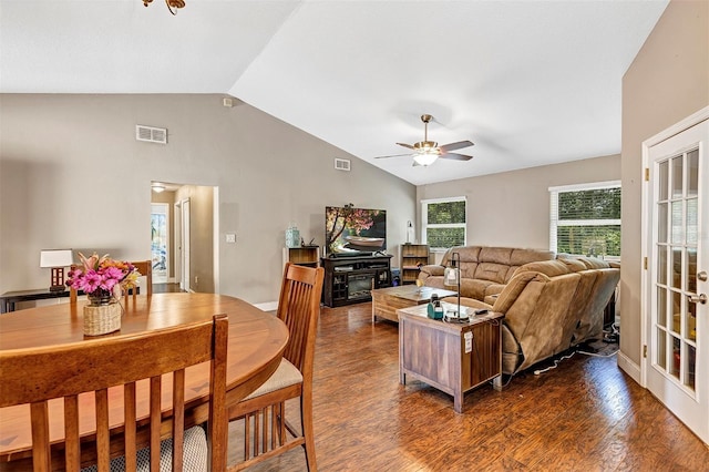 6906 Colony Oaks Ln, Orlando, FL 32818 - living room featuring a fireplace, dark wood finished floors, visible vents, and a ceiling fan