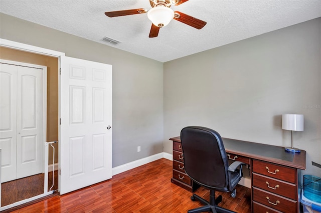 6906 Colony Oaks Ln, Orlando, FL 32818 - office area featuring a textured ceiling, baseboards, visible vents, wood finished floors, and ceiling fan