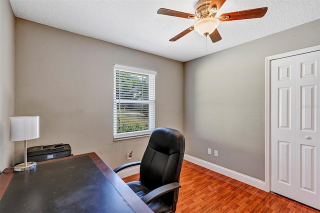 6906 Colony Oaks Ln, Orlando, FL 32818 - office area featuring wood finished floors, a textured ceiling, a ceiling fan, and baseboards