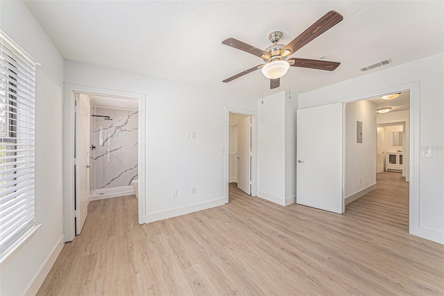 11901 4th St N Unit 2107, Saint Petersburg, FL 33716 - unfurnished bedroom with light wood-style flooring, baseboards, and ceiling fan