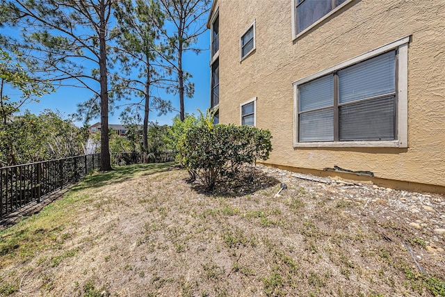 11901 4th St N Unit 2107, Saint Petersburg, FL 33716 - view of yard featuring fence