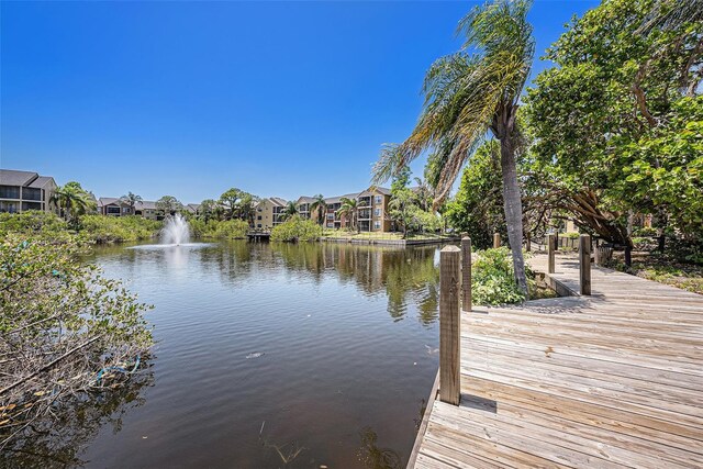 11901 4th St N Unit 2107, Saint Petersburg, FL 33716 - dock area featuring a water view and a residential view