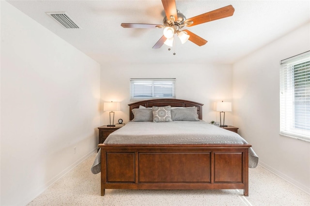 bedroom featuring visible vents, a ceiling fan, and baseboards