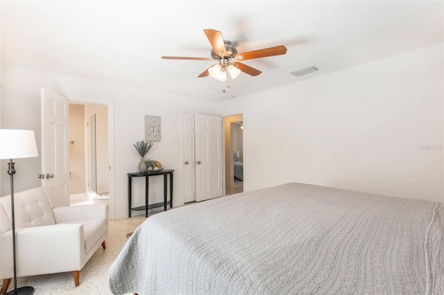 bedroom featuring visible vents, ceiling fan, and a closet