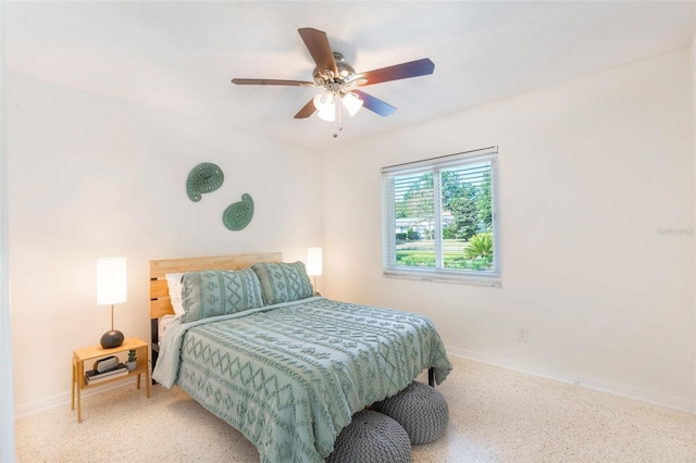 bedroom featuring baseboards and ceiling fan