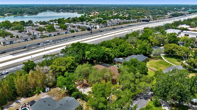 drone / aerial view featuring a water view and a residential view