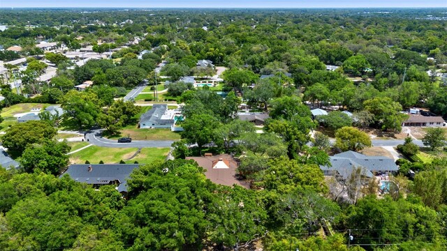 bird's eye view featuring a wooded view