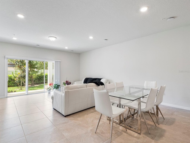 2812 Bright Bird Ln, Winter Park, FL 32792 - dining area featuring baseboards, recessed lighting, and a textured ceiling