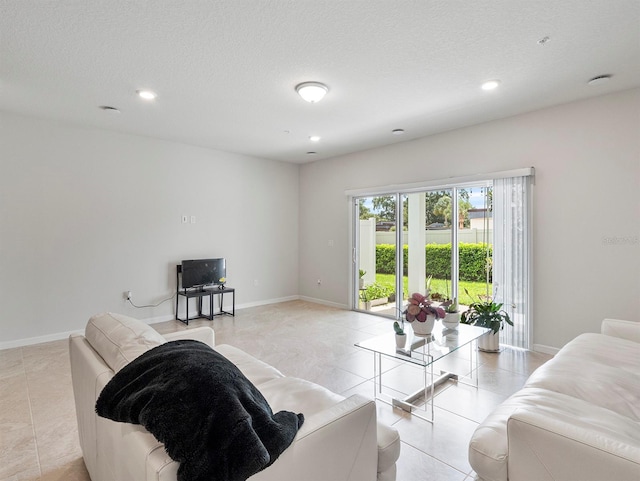 2812 Bright Bird Ln, Winter Park, FL 32792 - living room with recessed lighting, a textured ceiling, baseboards, and light tile patterned flooring