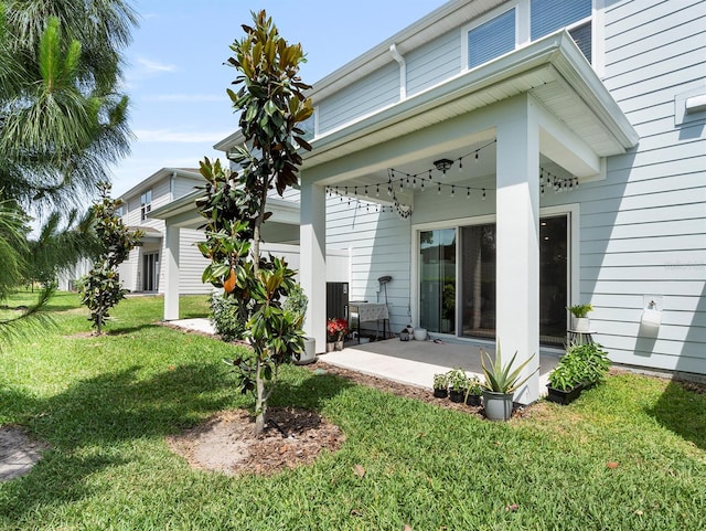 2812 Bright Bird Ln, Winter Park, FL 32792 - back of property with a patio area and a lawn