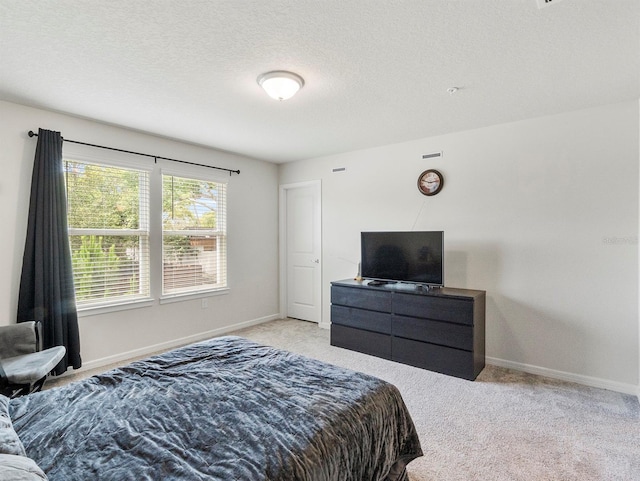 2812 Bright Bird Ln, Winter Park, FL 32792 - bedroom featuring light colored carpet, baseboards, and a textured ceiling